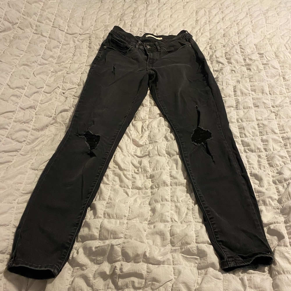 High-waisted, distressed, curvy, black Levi’s